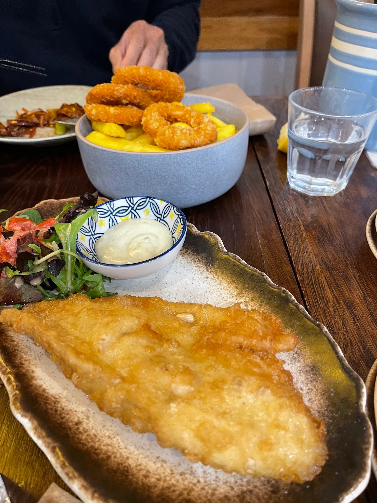 Food served in a bento-style arrangement showing the variety available at Blue Fin